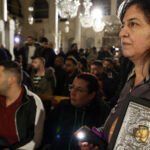 Hundreds of Syrian Christians protest against the burning of a Christmas tree