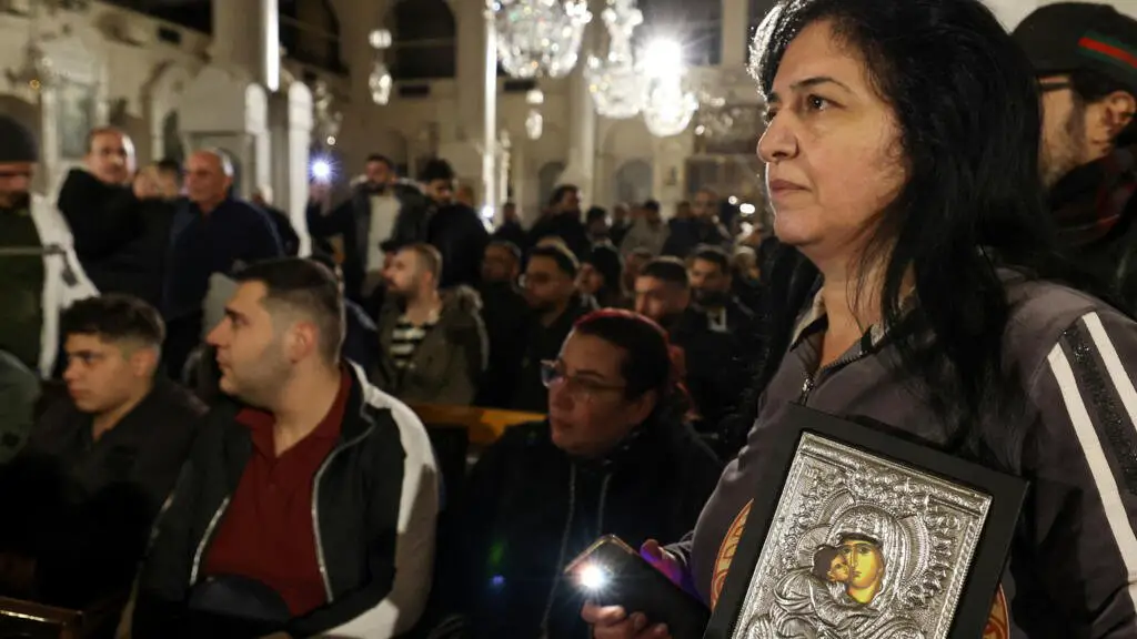 Hundreds of Syrian Christians protest against the burning of a Christmas tree