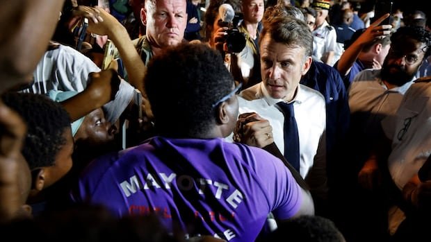 French President Macron in an angry exchange with frustrated residents in cyclone-hit Mayotte