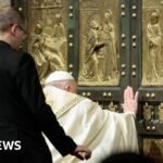 Pope Francis opens the Holy Door in St. Peter’s Basilica at the start of the special anniversary year