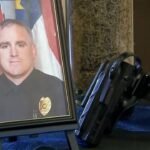 A North Carolina police officer was shot and killed in a grocery store