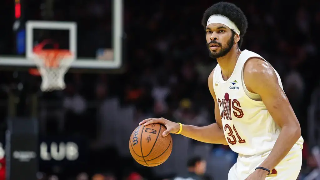 Jarrett Allen of the Cavs stuns fans with a reverse shot at halfcourt before the game