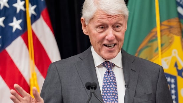 Bill Clinton was hospitalized in Washington with a fever but in “good spirits,” a spokesman says