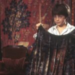 Who gave Harry Potter the Invisibility Cloak in the Philosopher’s Stone?