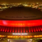Where is the event location of the NFL championship game? Stadium, city, in which Lionel Messi could participate
