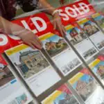 British real estate prices are falling in February with the end of the stamp tax holiday, says Halifax